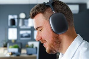 a man with a beard wearing a headset