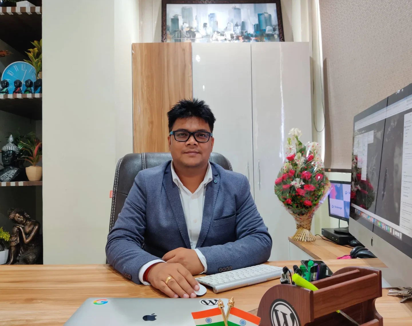 Varun Dubey, founder of Wbcom Designs, at his desk in the office