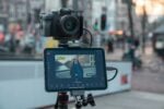 Camera and tablet on tripod for video marketing content production