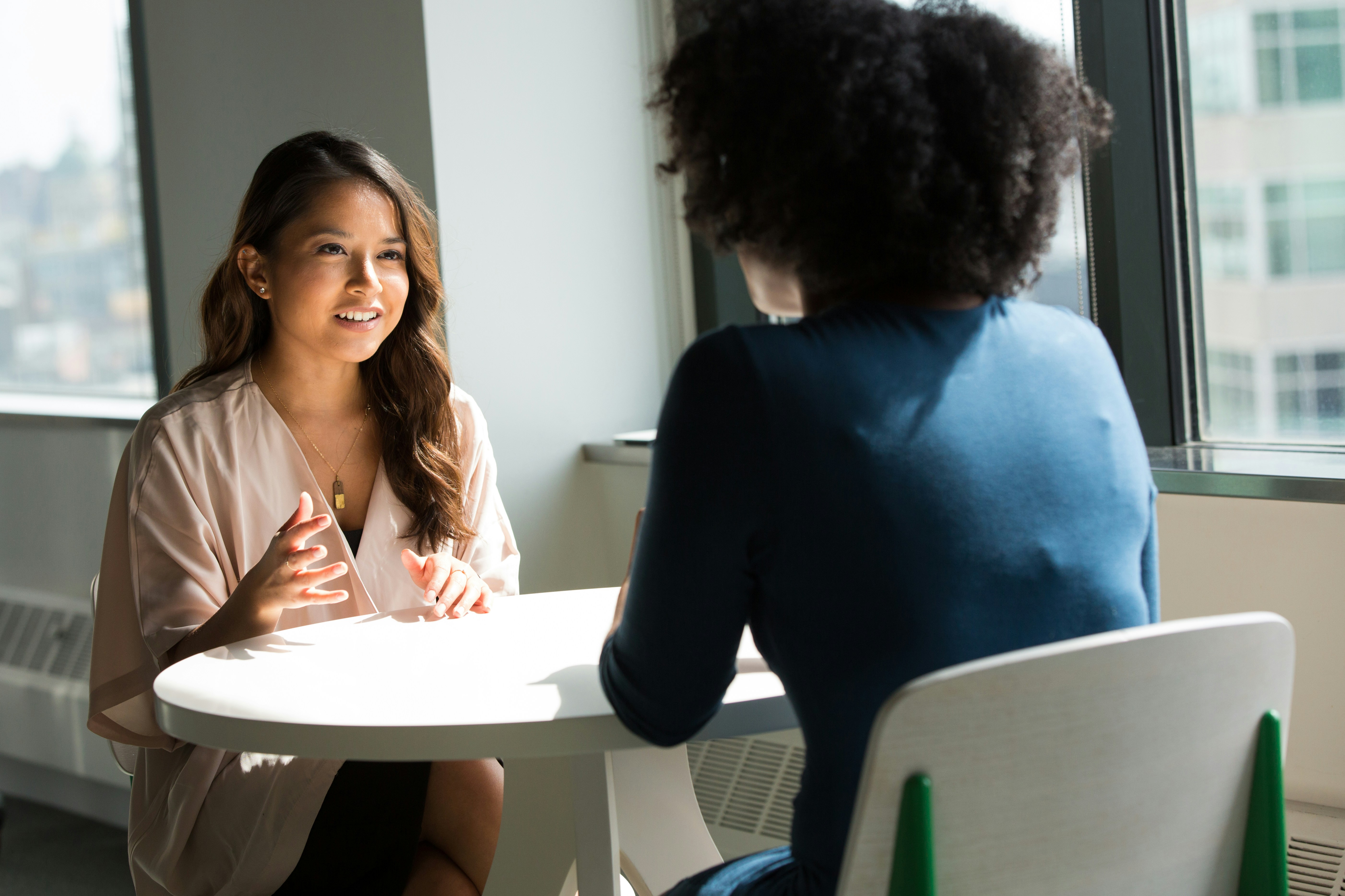 Two alumni talking during a mentorship conversation