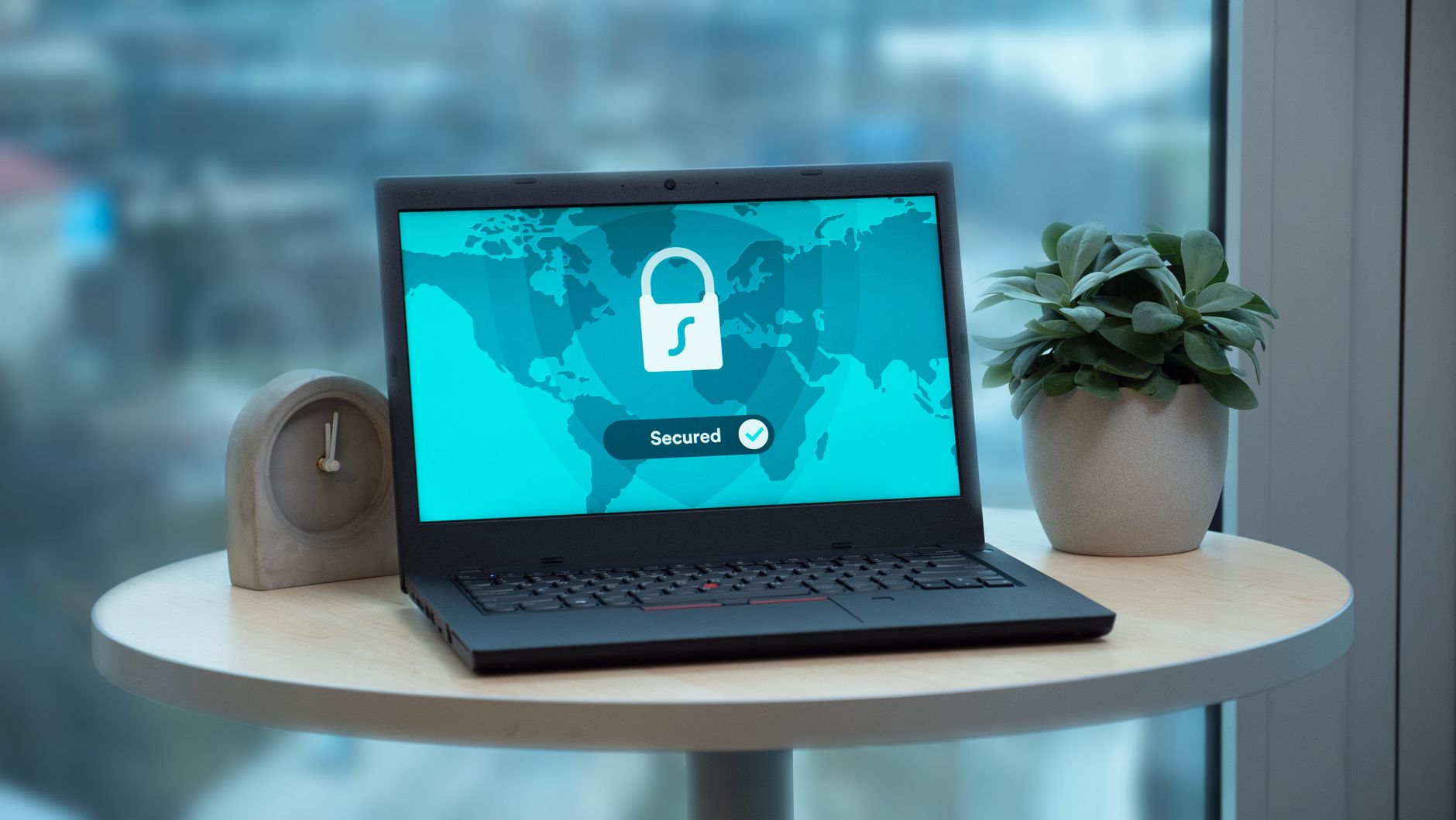 Laptop screen showing a secured, encrypted connection lock icon, representing dependency security