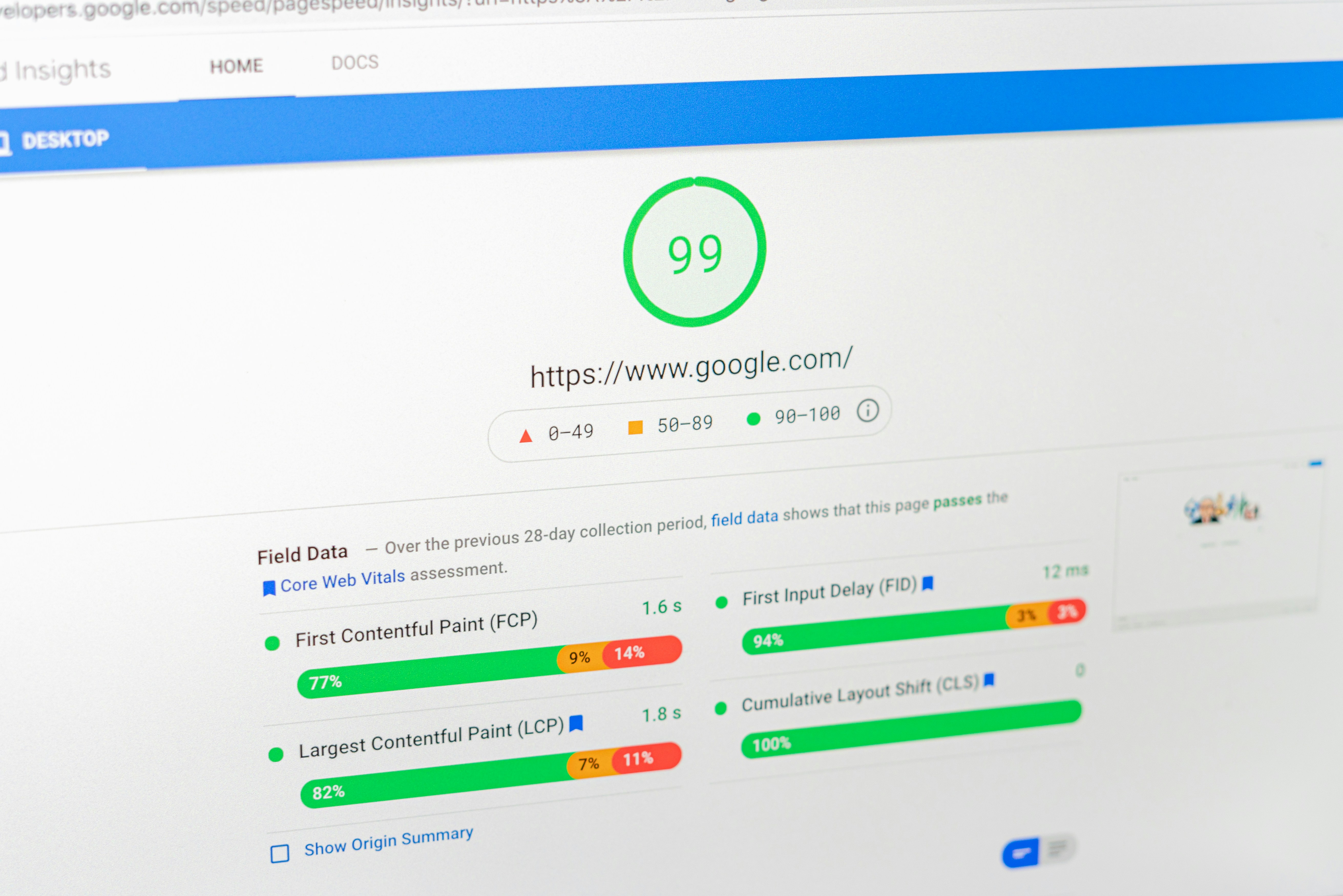 Laptop screen showing a Google PageSpeed Insights performance score