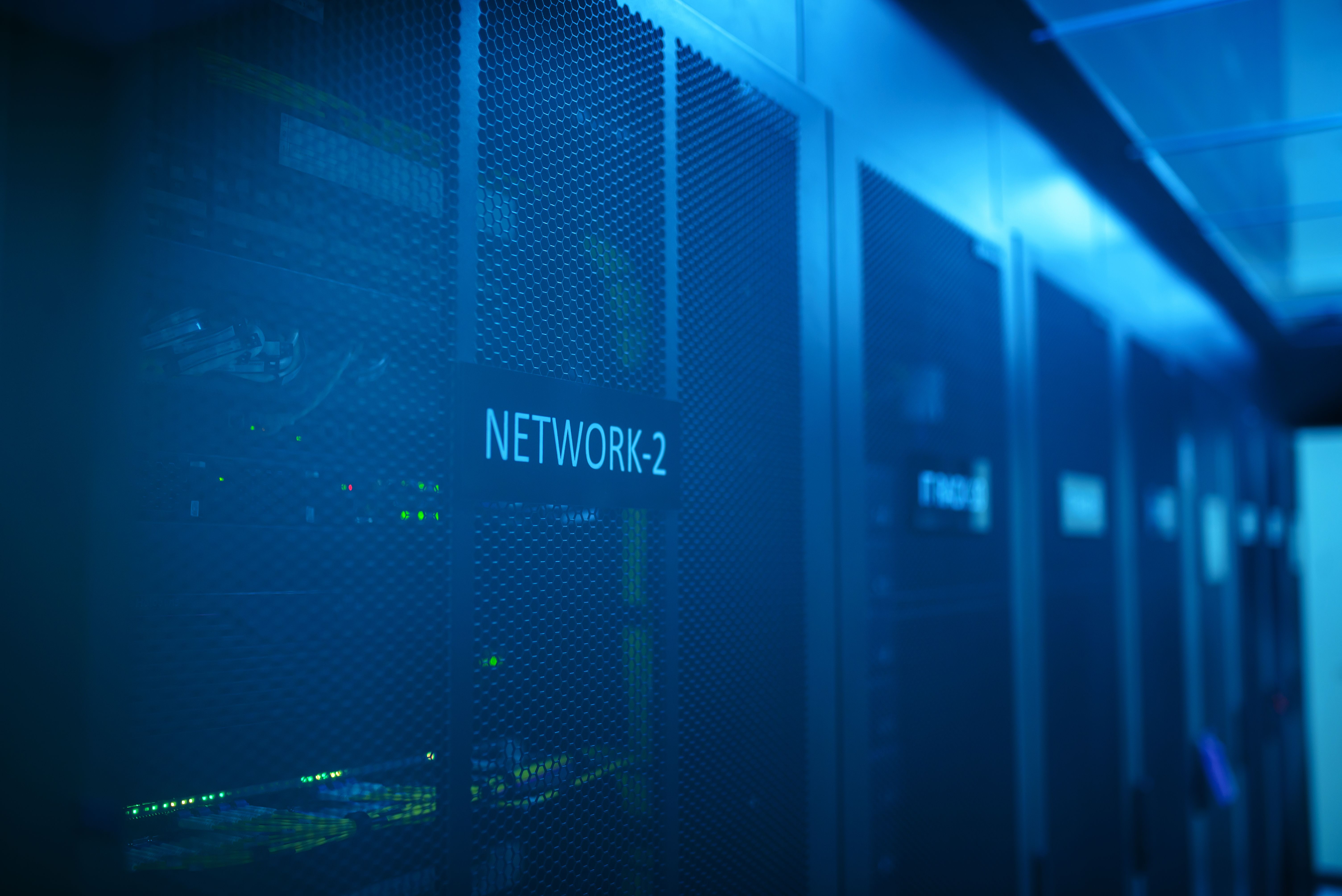 Modern server room network equipment with blue illumination