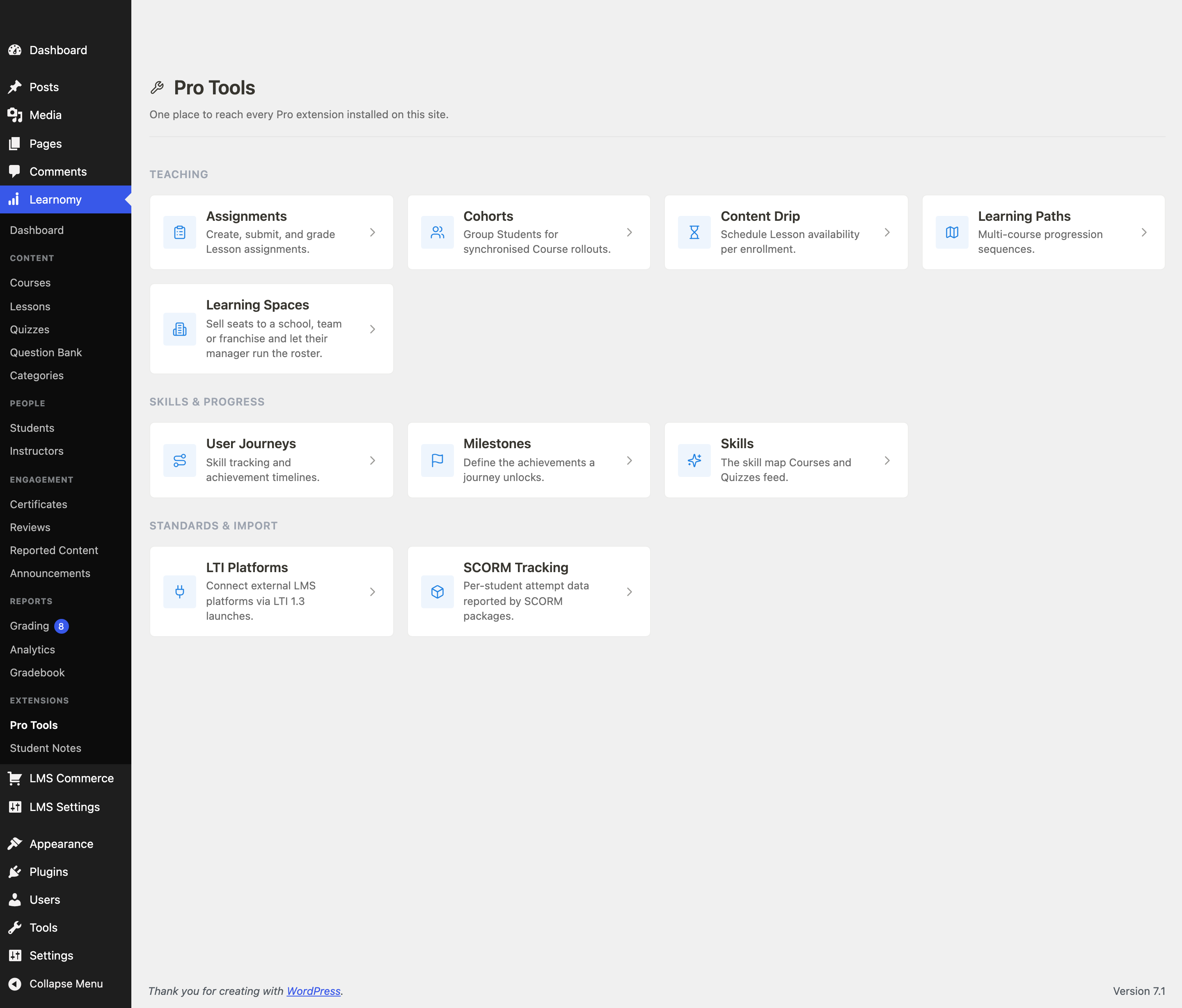 Learnomy Pro Tools hub showing cards for Assignments, Cohorts, Content Drip, Learning Paths, Learning Spaces, User Journeys, Milestones, Skills, LTI Platforms, and SCORM Tracking