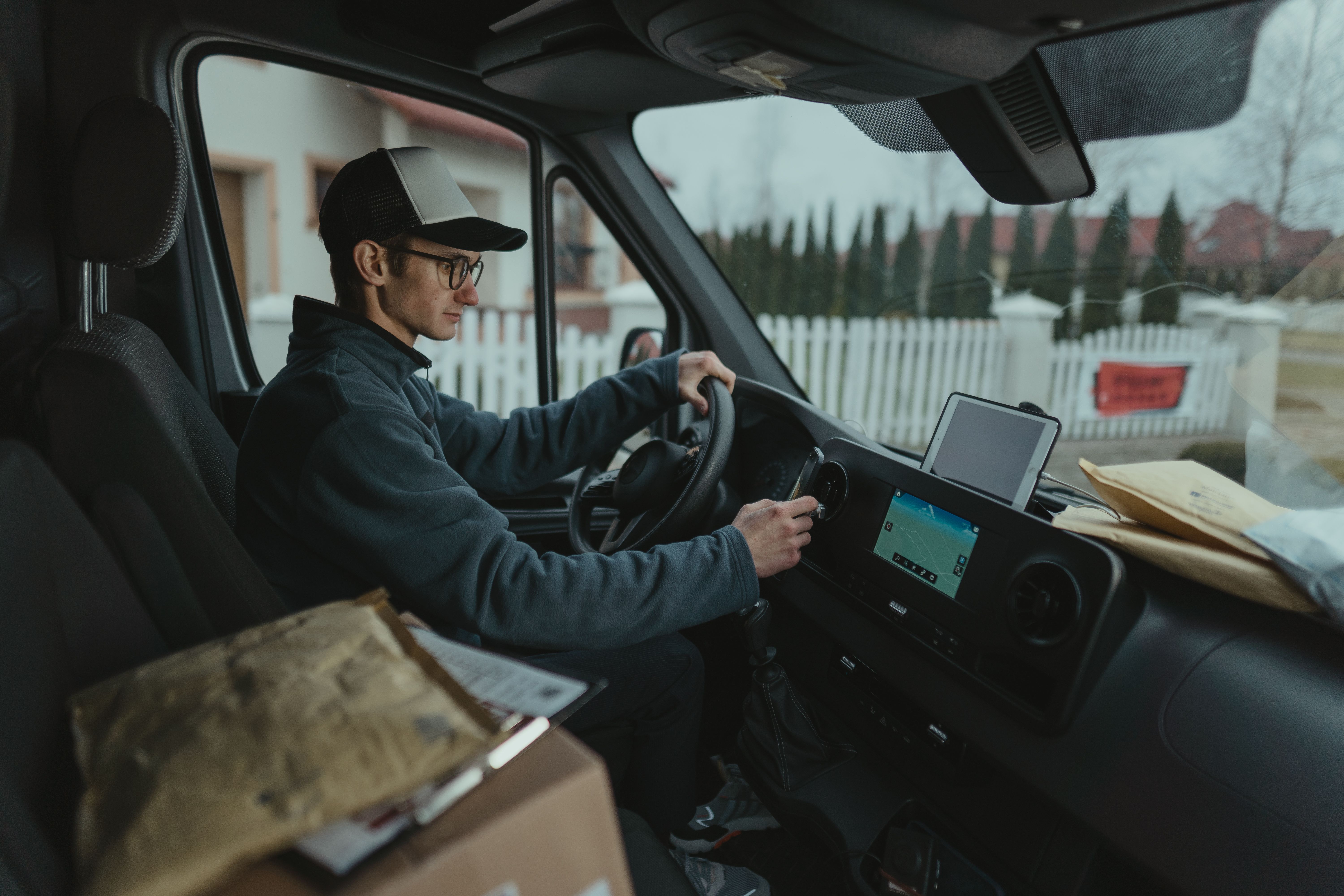 Delivery van driver using GPS for route optimization